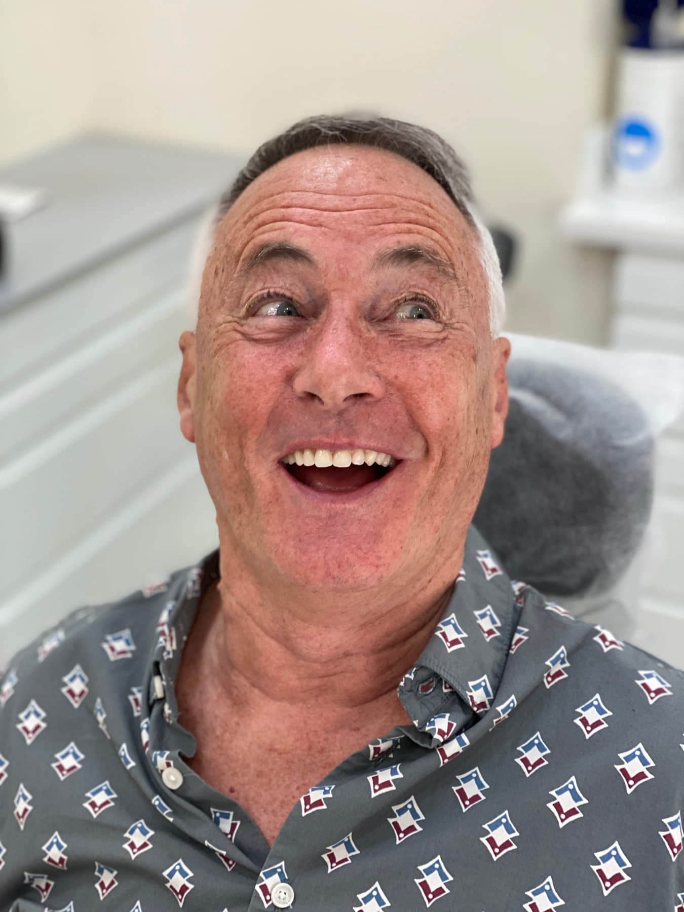 Smiling patient following dental implant treatment