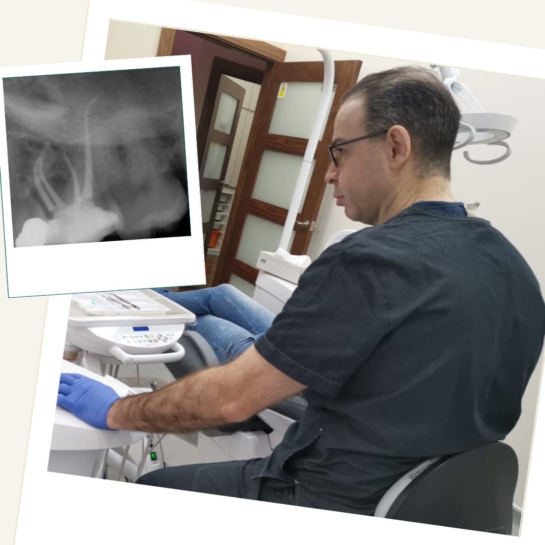 Dr Firas Daoudi reviewing an endodontic case with a dental radiograph